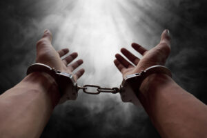 man's hands in cuffs