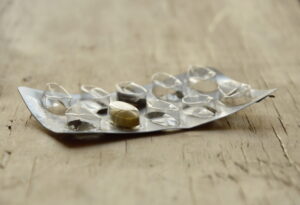 last pill in blister pack on wooden board