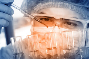Chemist analyzing sample in laboratory room.