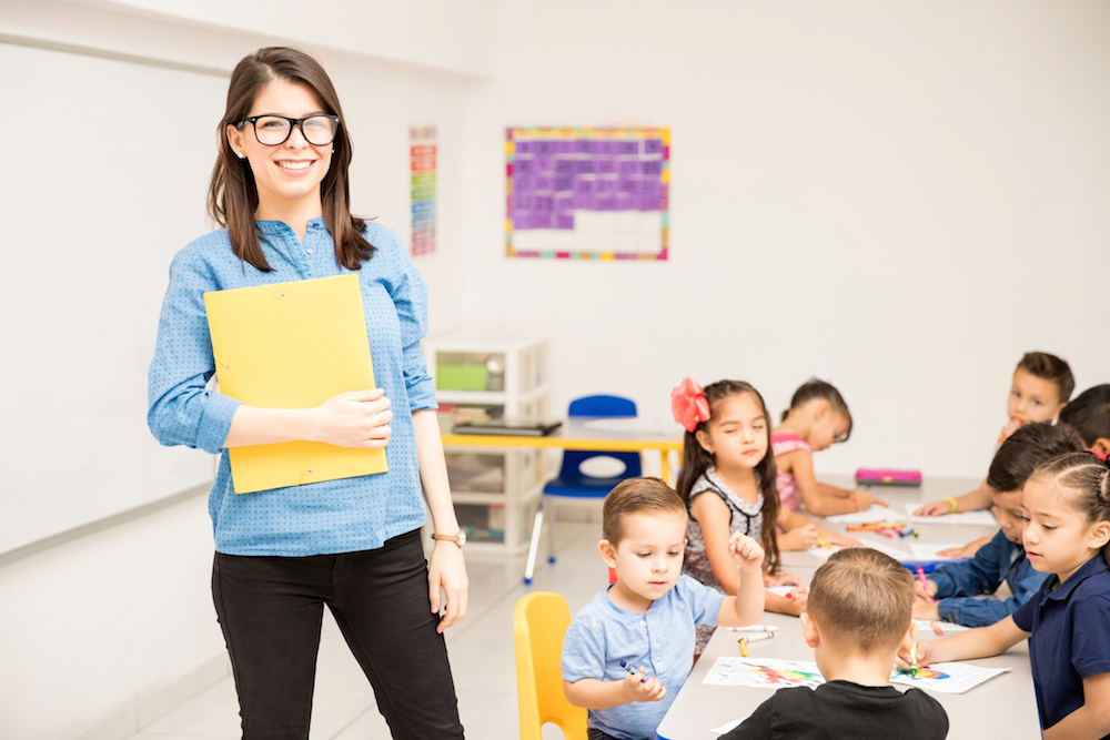 Teacher standing in front of kindergarten class