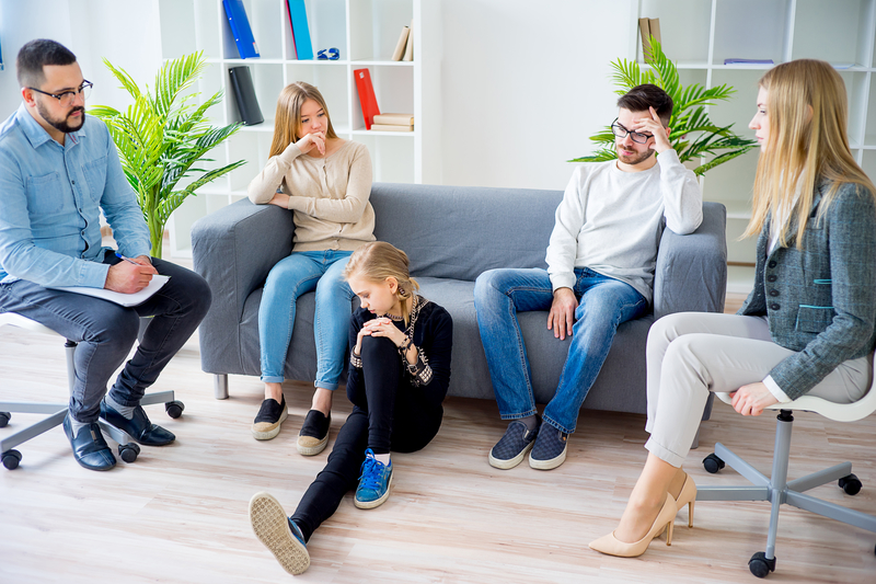 Teenage girl and her family in therapy
