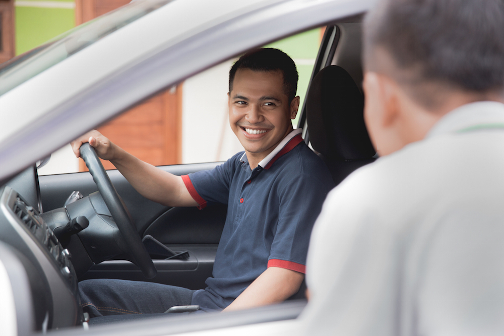 man talking to driver
