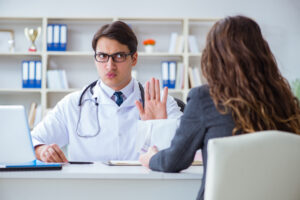 young doctor saying no to patient