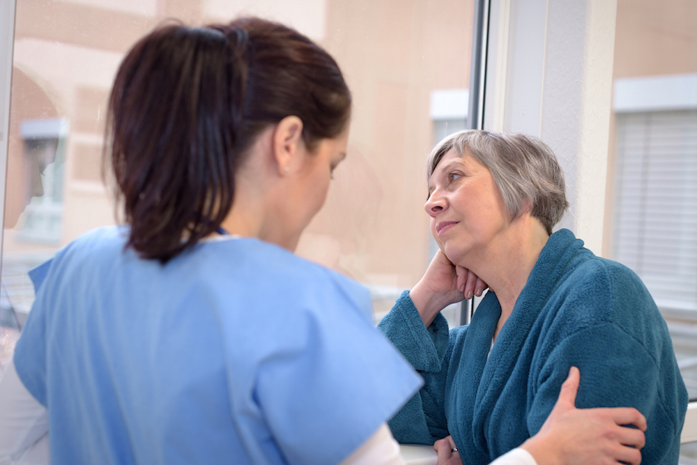 nurse comforting patient