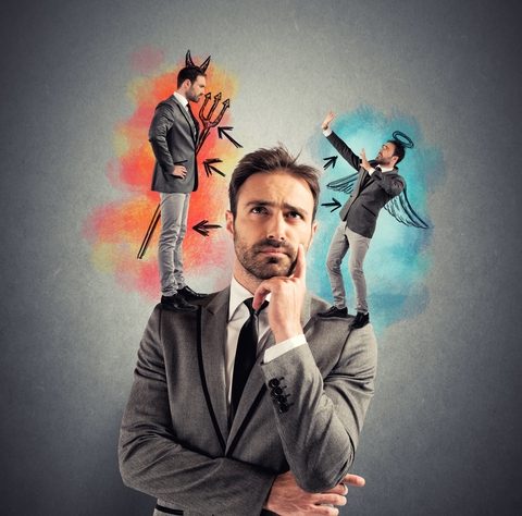 a businessman with a devil and angel over opposing shoulders.