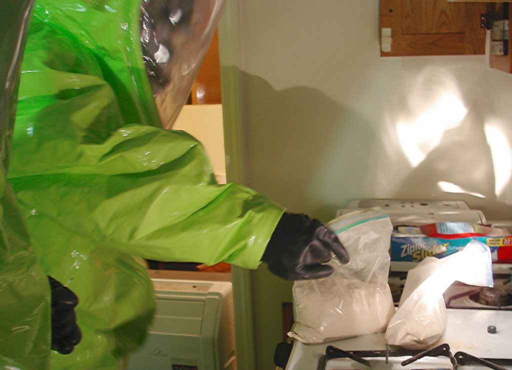 Member of the DEA's fentanyl response team examining fentanyl