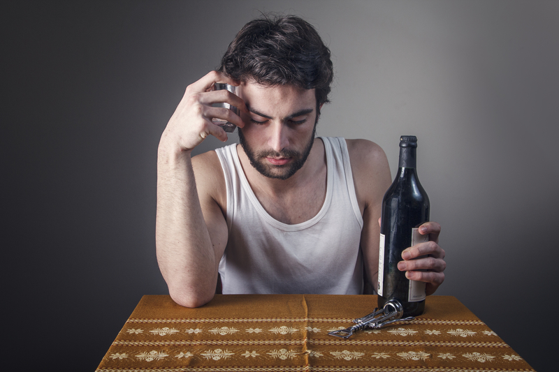 sad man drinking alcohol