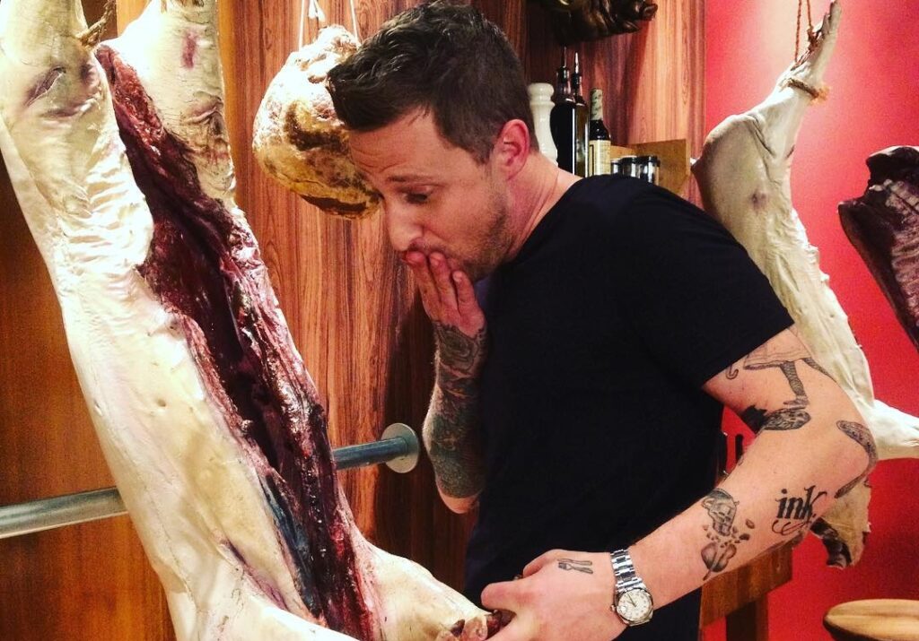 Voltaggio, chef, inspects a pig on Instagram.