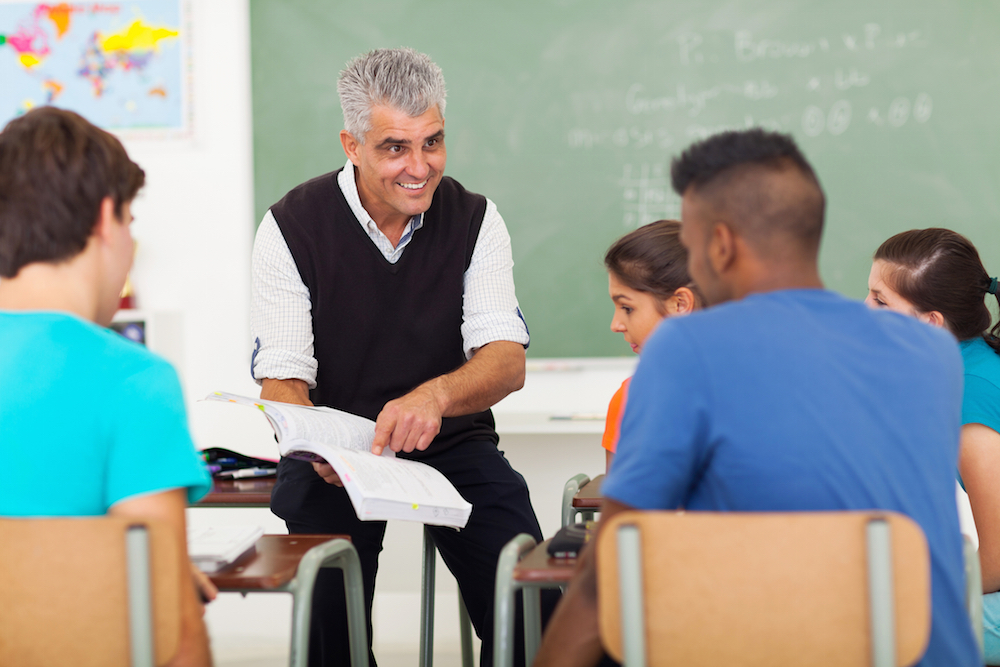 A teacher teaching students in a classroom