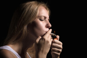 Woman lighting a joint