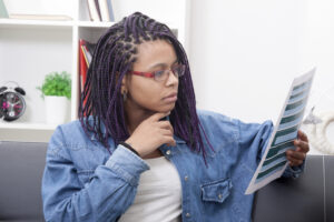 woman reading a laminated sheet