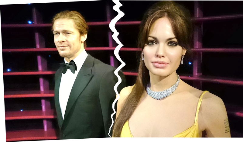A torn picture of wax figures of Brad Pitt and Angelina Jolie