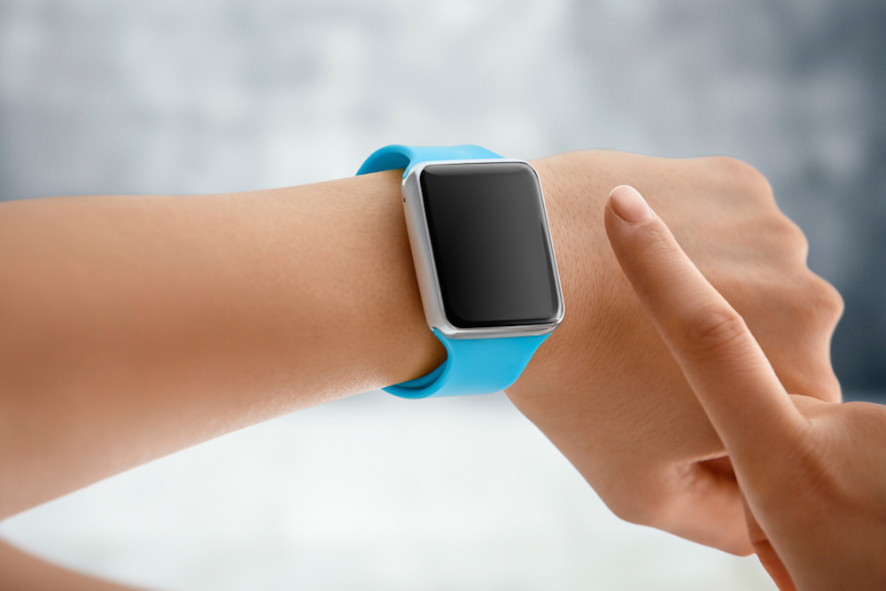 woman using smartwatch