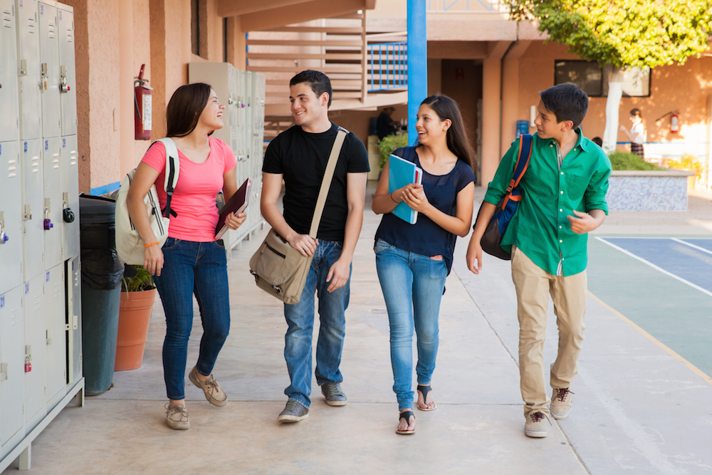 students walking on a high school campus