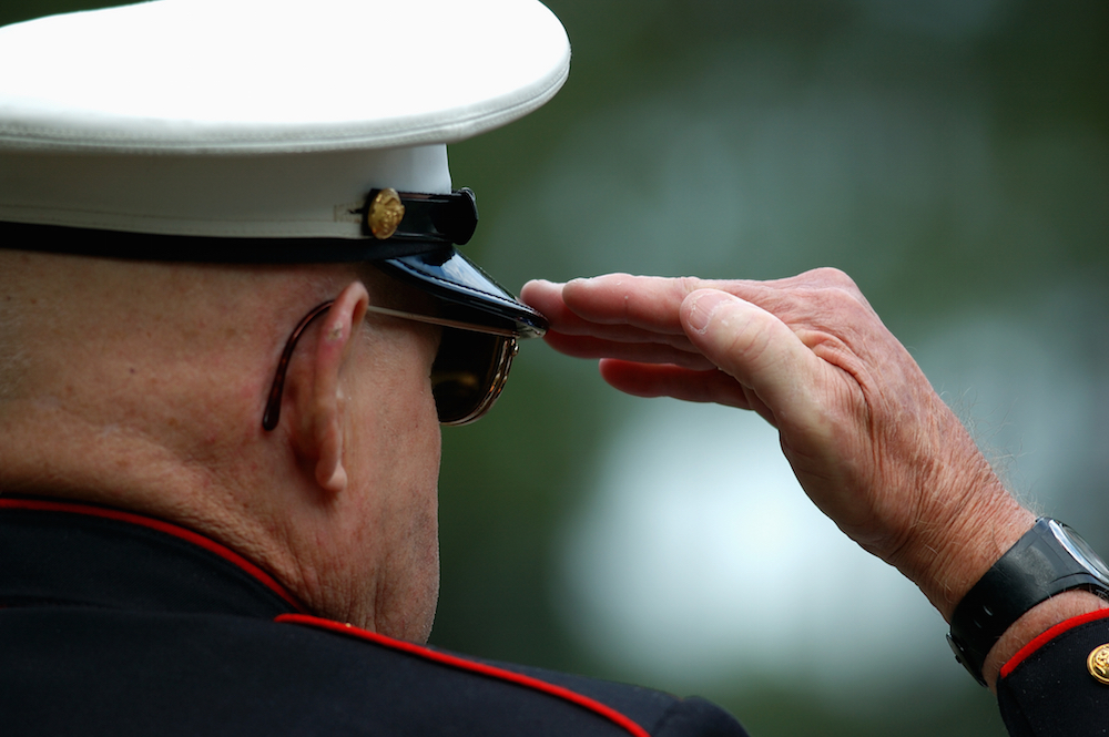 uniformed veteran saluting