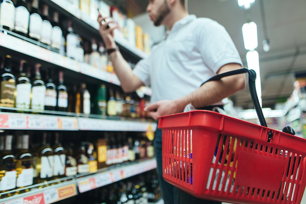 Man shopping for alcohol in market