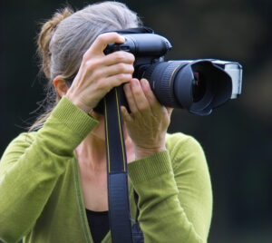 woman taking pictures with camera