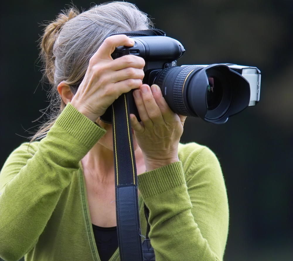 woman taking pictures with camera