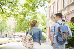 pair of students walking on a college campus
