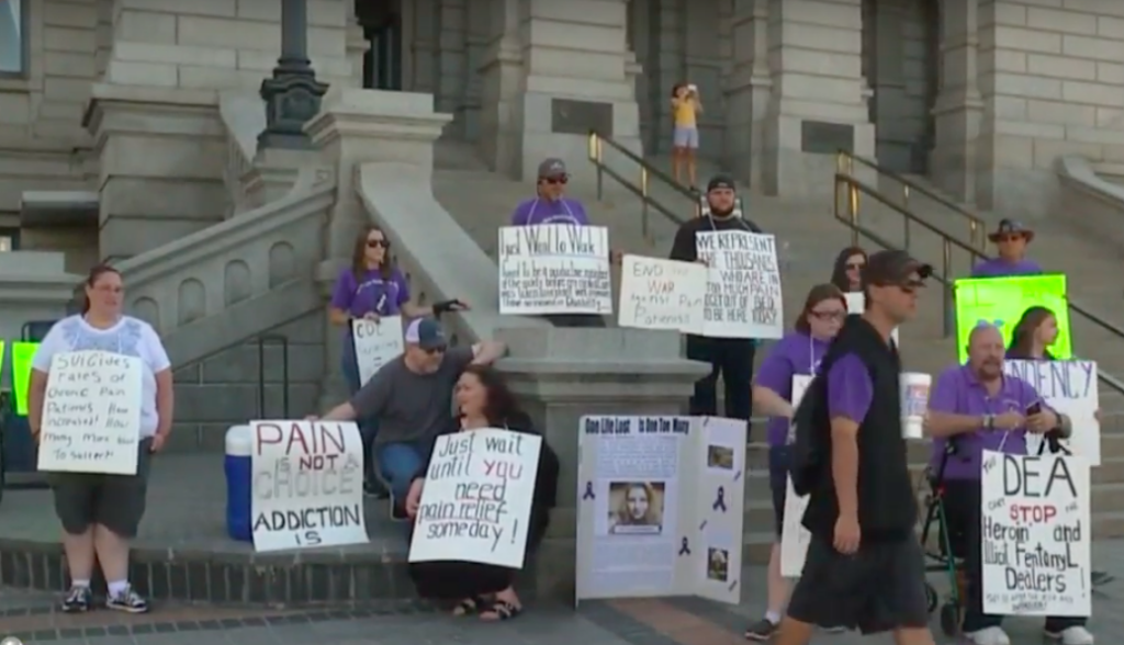 Participants at the Don't Punish Pain rally in Denver