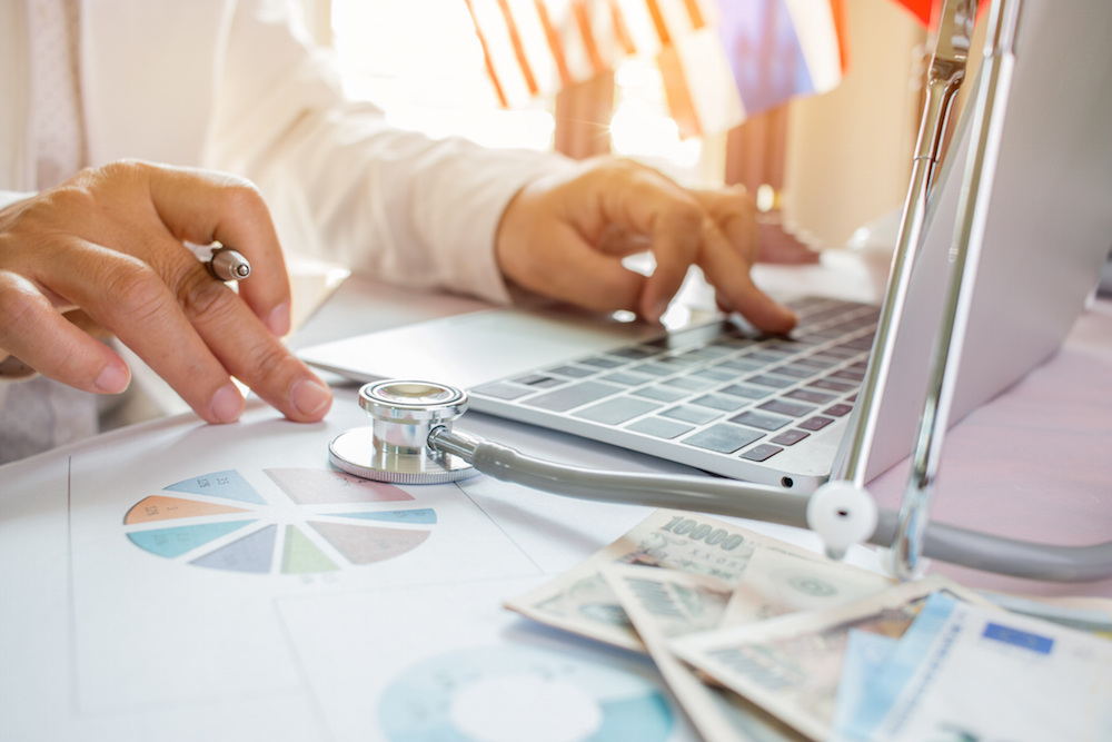 doctor checking laptop