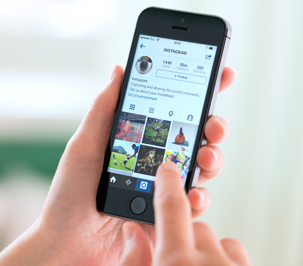 hand navigating instagram on the phone