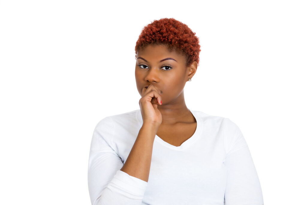 7 Reasons Why I Thought AA Wasn’t for “Someone Like Me” Woman looking skeptical with hand at mouth.