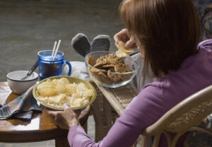 woman eating junk food.