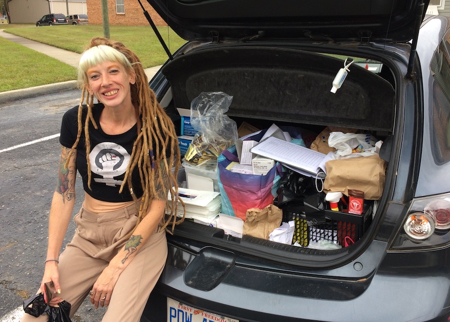 Nicole Reynolds with harm reduction supplies in her car; opioid overdose prevention