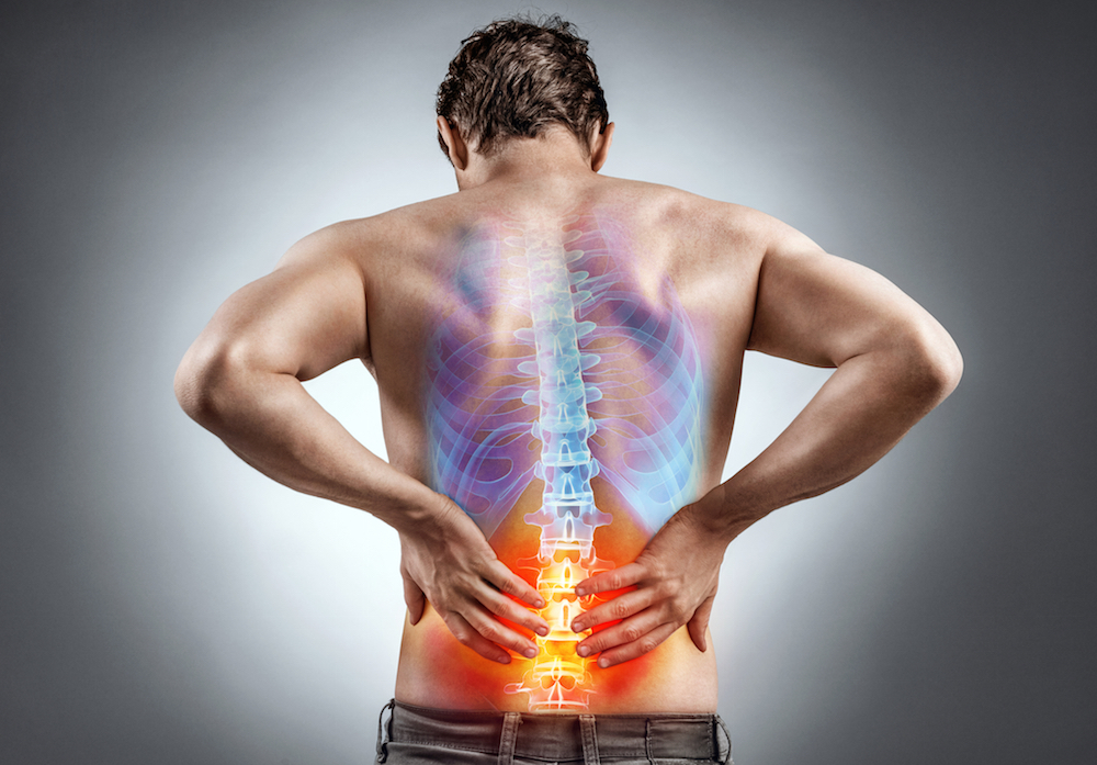 man with back pain waiting for new non-opioid treatment for back pain