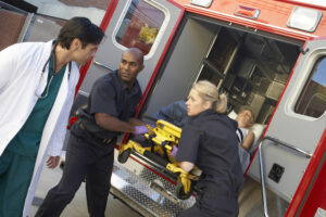 Paramedics preparing to unload patient from ambulance