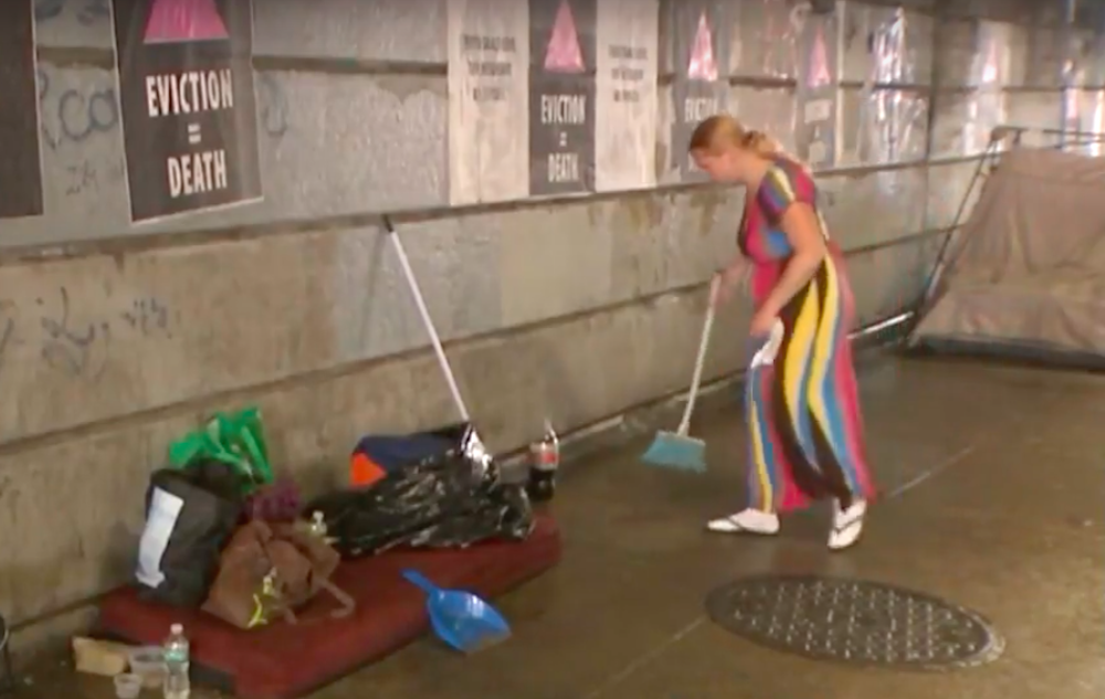 worker cleaning up a heroin encampment in Philadelphia