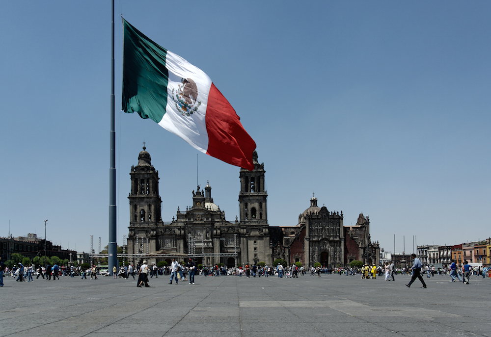 Mexican national flag flying in the Zocalo as the nation mulls over marijuana legalization