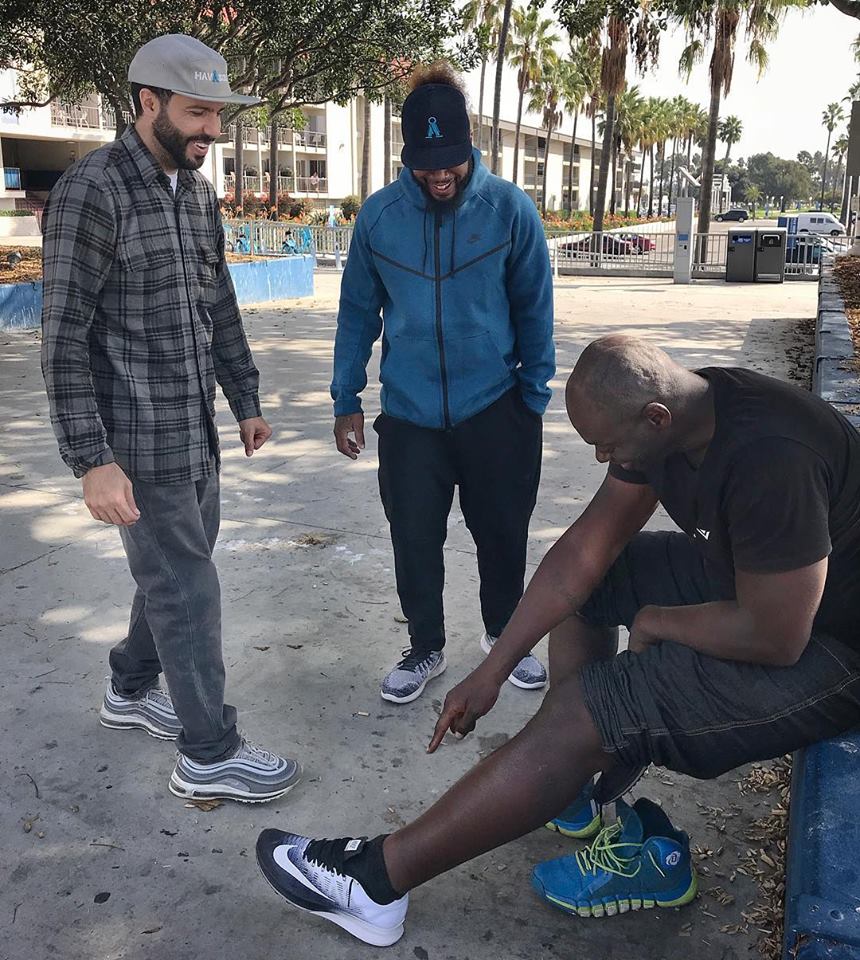 Rikki of Hav A Sole and volunteer Dash provide shoes to happy recipient. Homeless outreach