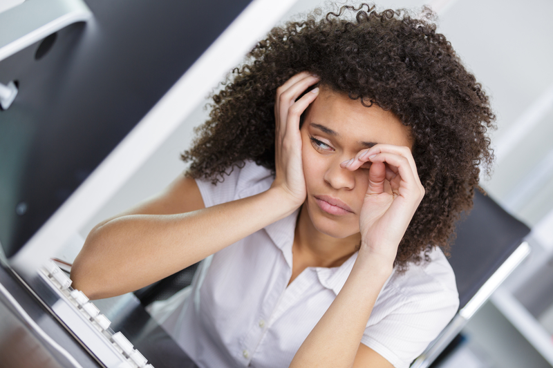 Woman looks depressed, holds head in hand. Suffering gabapentin withdrawal