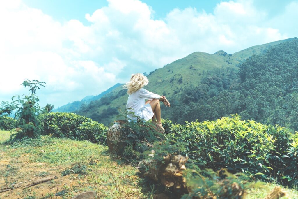 Woman on rock in Sri Lanka; mindfulness meditation