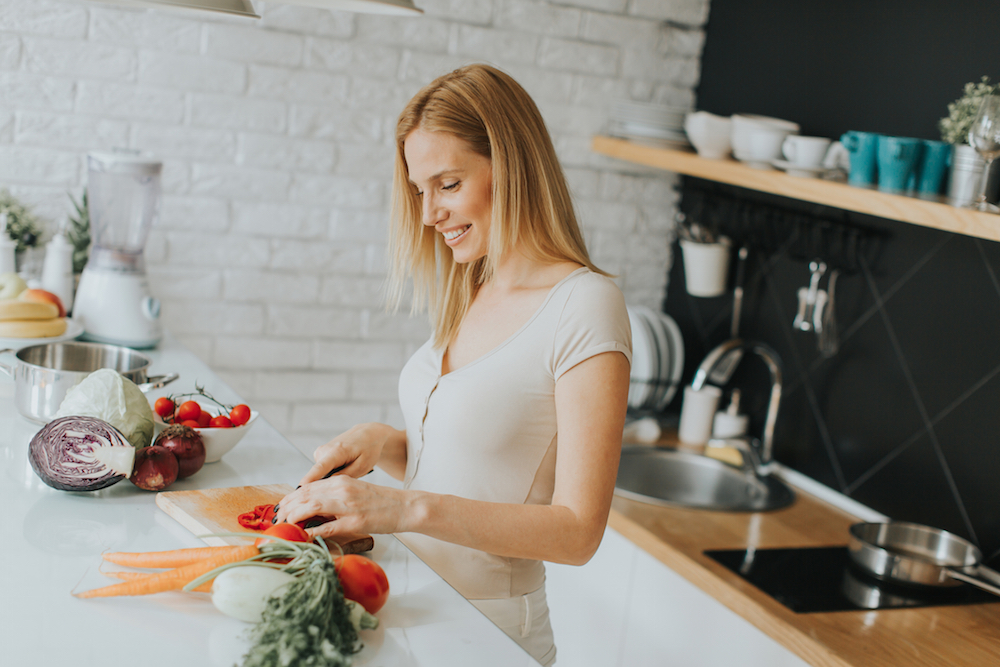 woman preparing a meal to eat in recovery