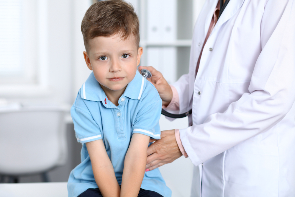 4-year-old boy being examined by doctor