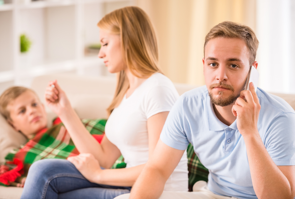 parents taking care of sick child