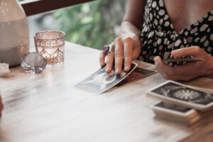 woman reading tarot cards for mental health