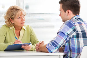 addiction treatment provider helping a patient
