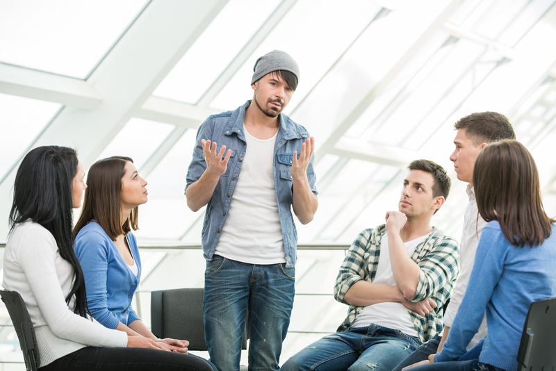 AA meeting with one person addressing the group, terminally unique, AA groupthink