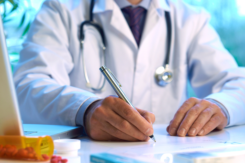 doctor writing prescription for buprenorphine