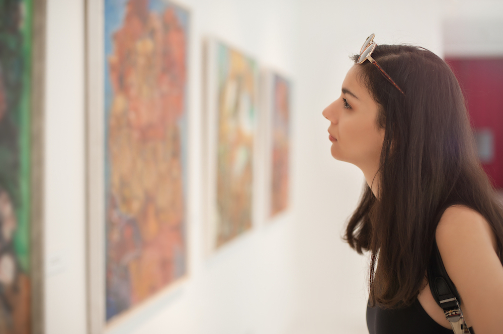 woman looking at new photo exhibit