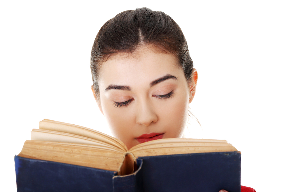 woman reading AA's big book