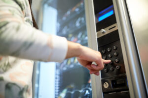 man making a selection at a vending machine