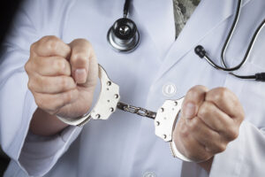 doctor handcuffed after receiving 20-year sentence