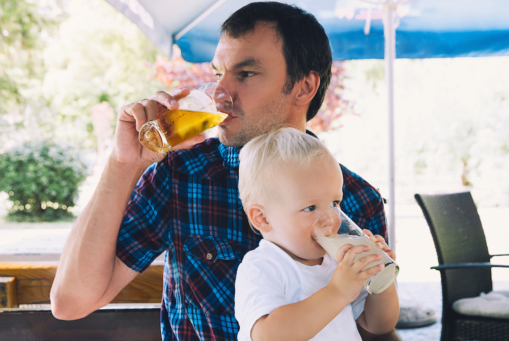 dad drinking with young son