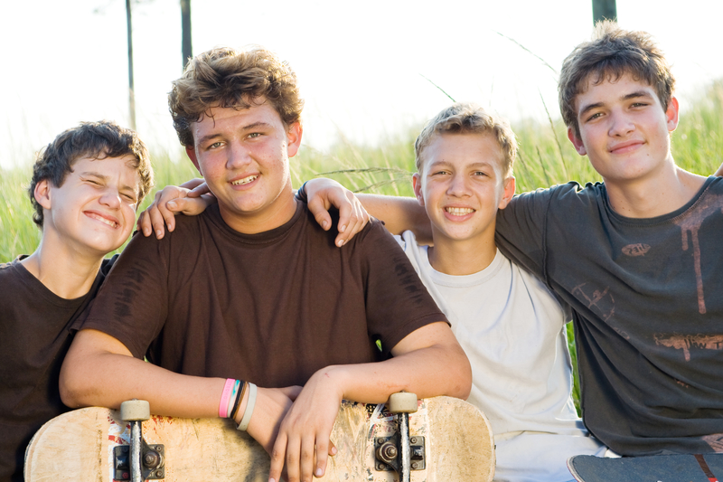Teen boys relaxing together, friendship, fun in sobriety