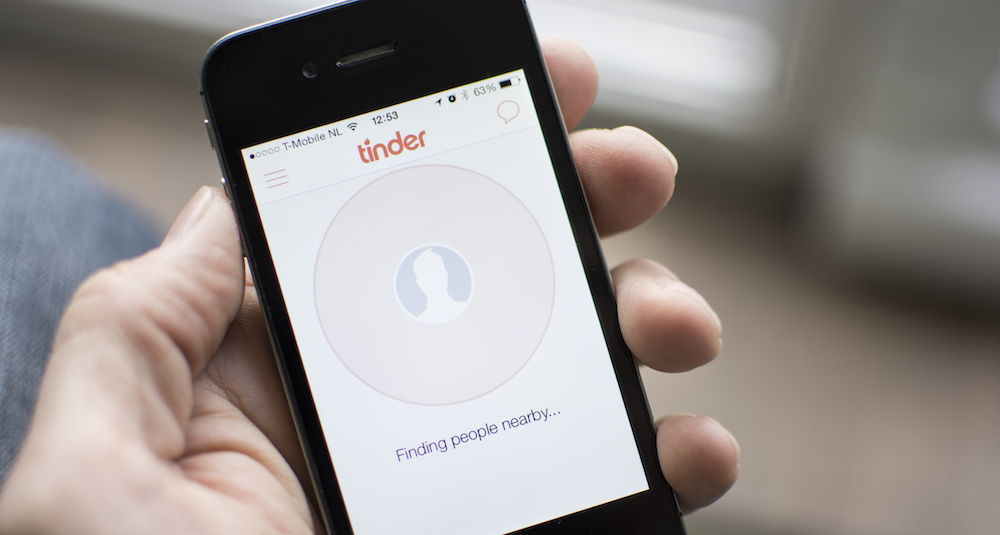 person using Tinder app